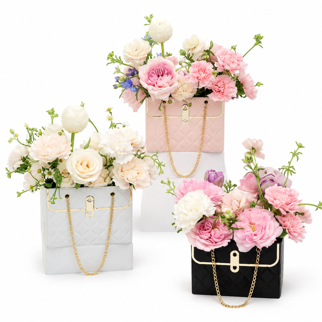 💐 50% OFF! ✨ Embossed Bouquet Gift Bag – Premium Embossed Cardboard Build, Chic Metallic Chain Carry Handle, Quilted Texture Metal Grommet Reinforcement & Self-Standing Stable Base – 4 Colors 3 Quantity Options 🎁
